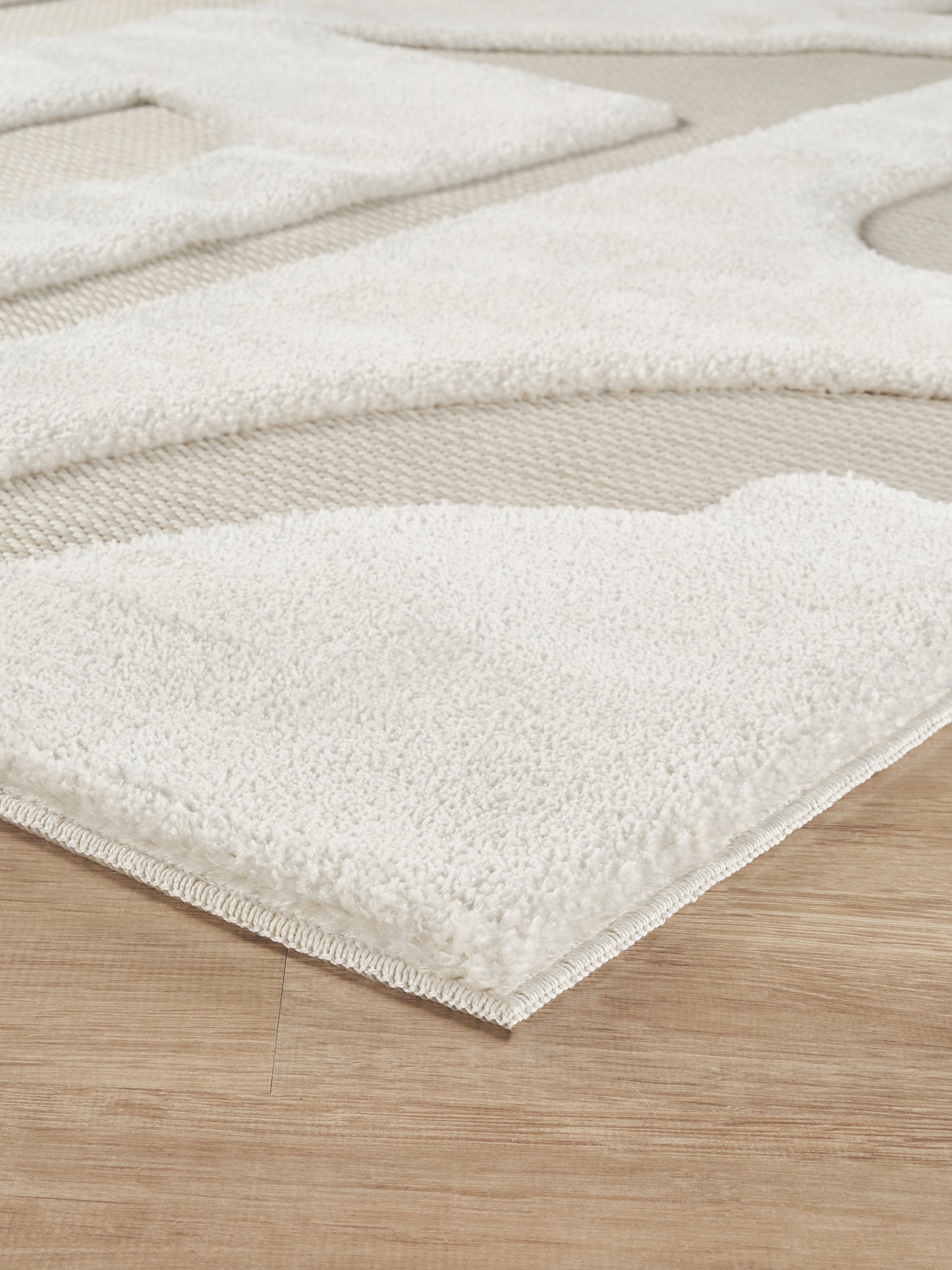 Cream Freya Boho embossed geometric rug, side profile