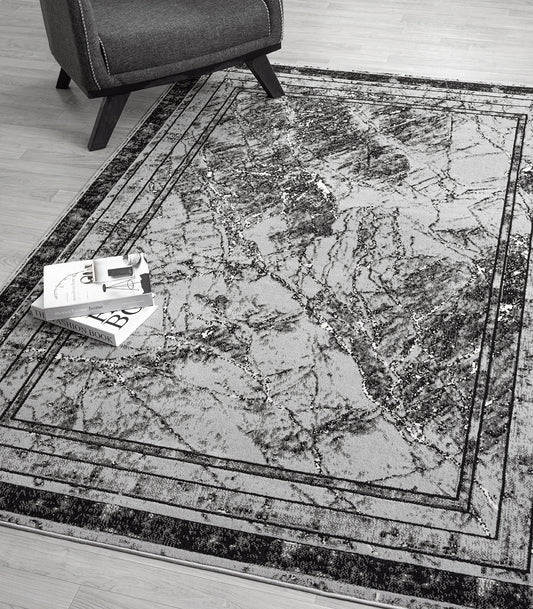 Grey Obsidian Frame monochrome rug, in a room setting 2