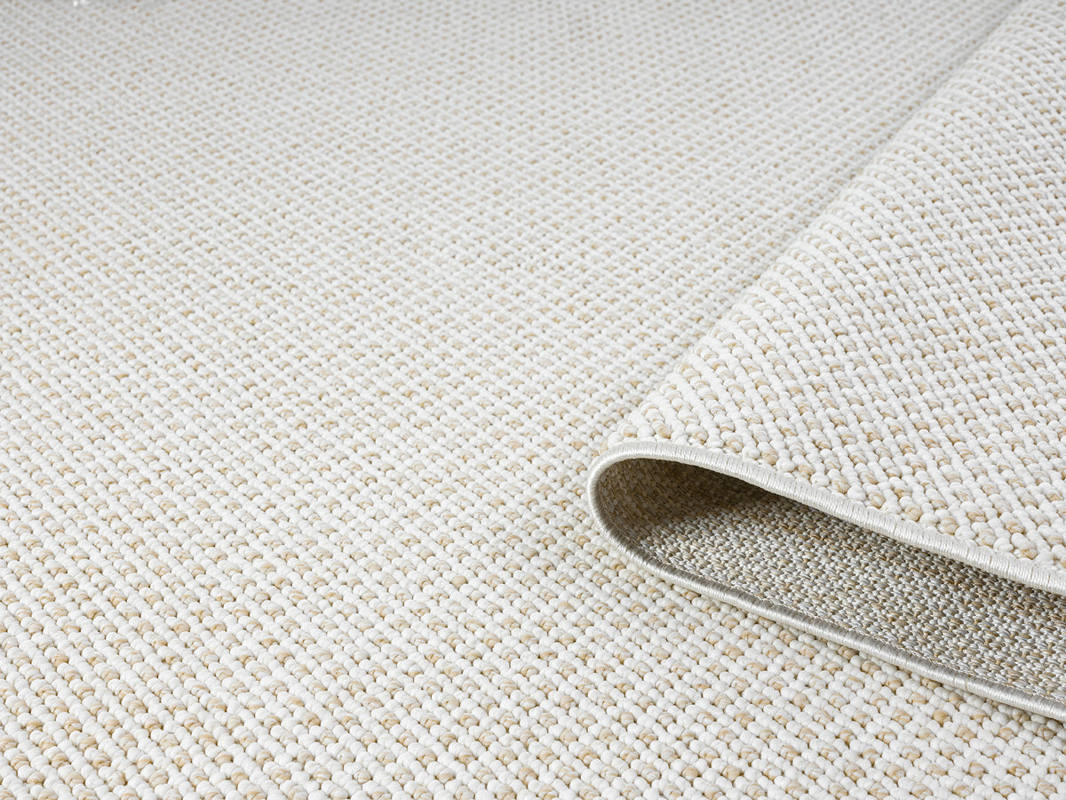Cream Avior Mottle bobble rug, rolled view