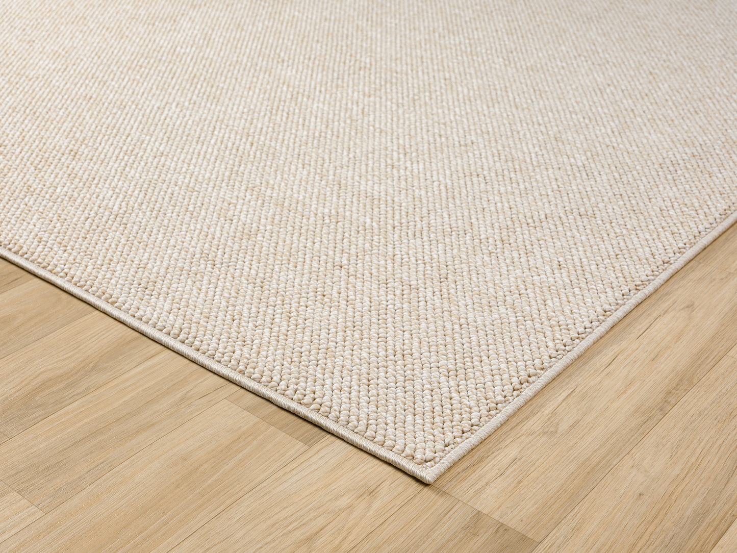 Beige Avior bobble rug, corner fold detail