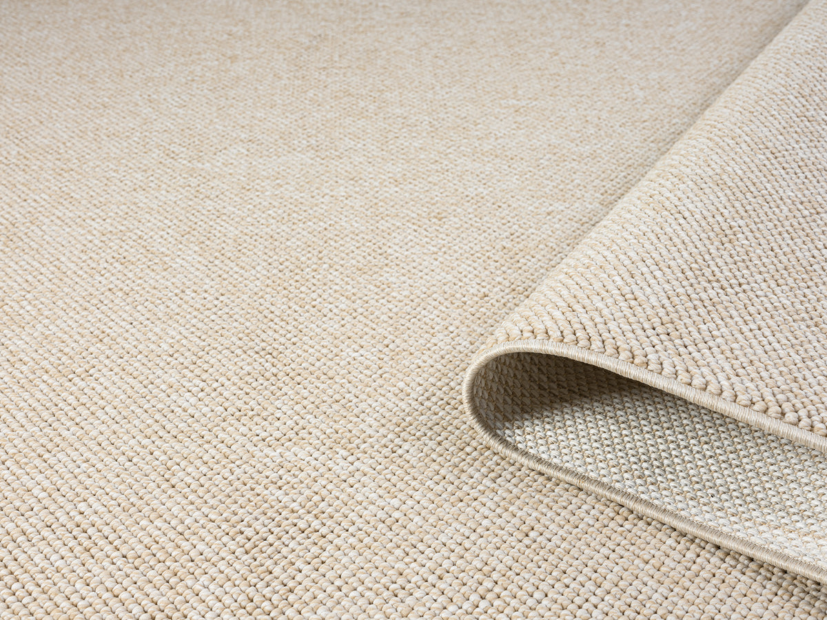 Beige Avior bobble rug, rolled view