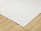 Cream Avior bobble rug, corner fold detail