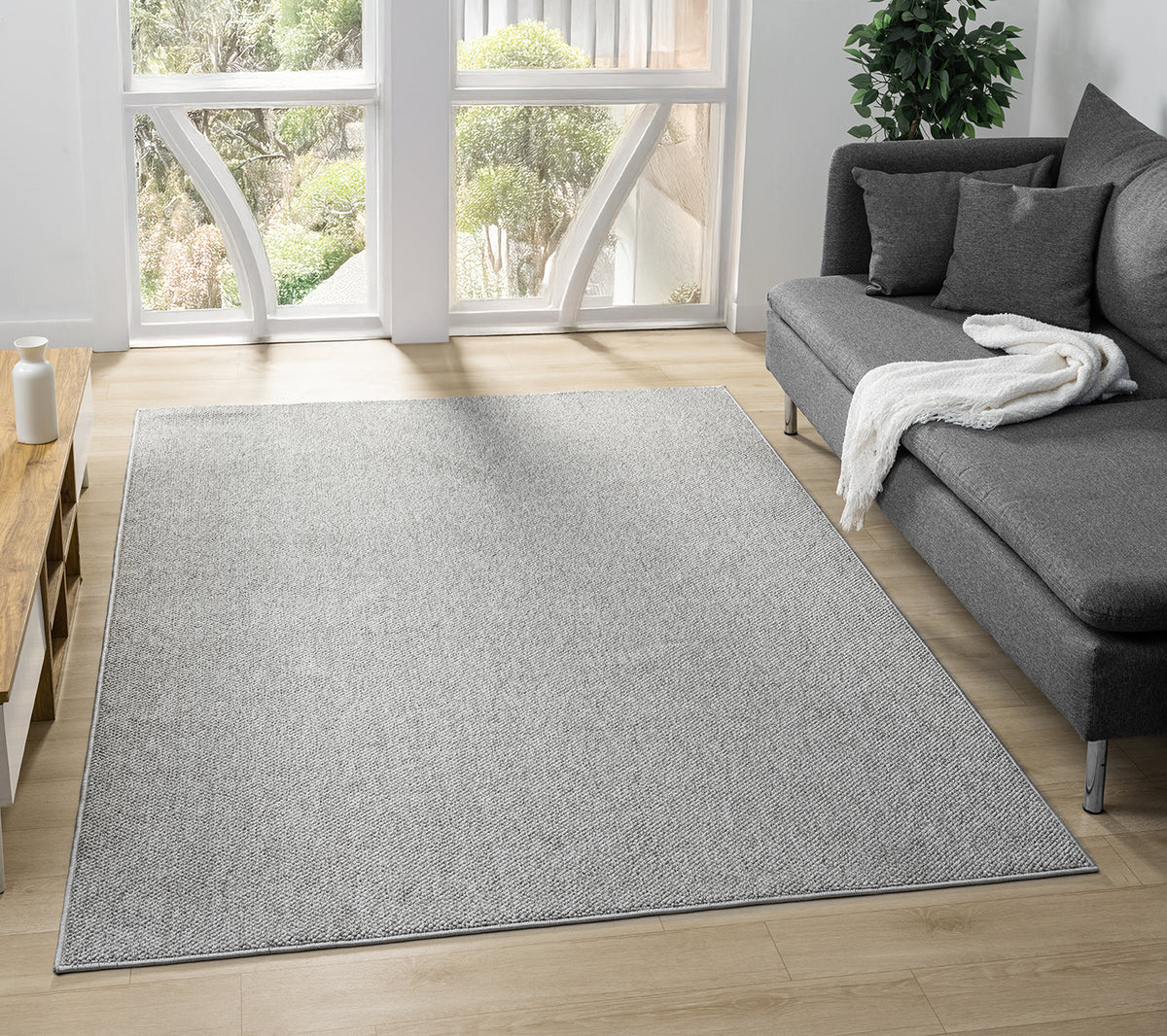 Grey Avior bobble rug, in a room setting