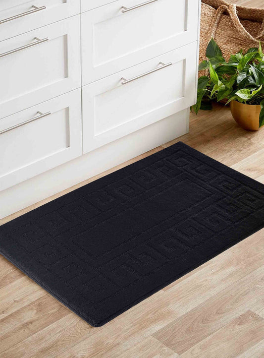 Black Ivy Greek Key door mat, in a room setting