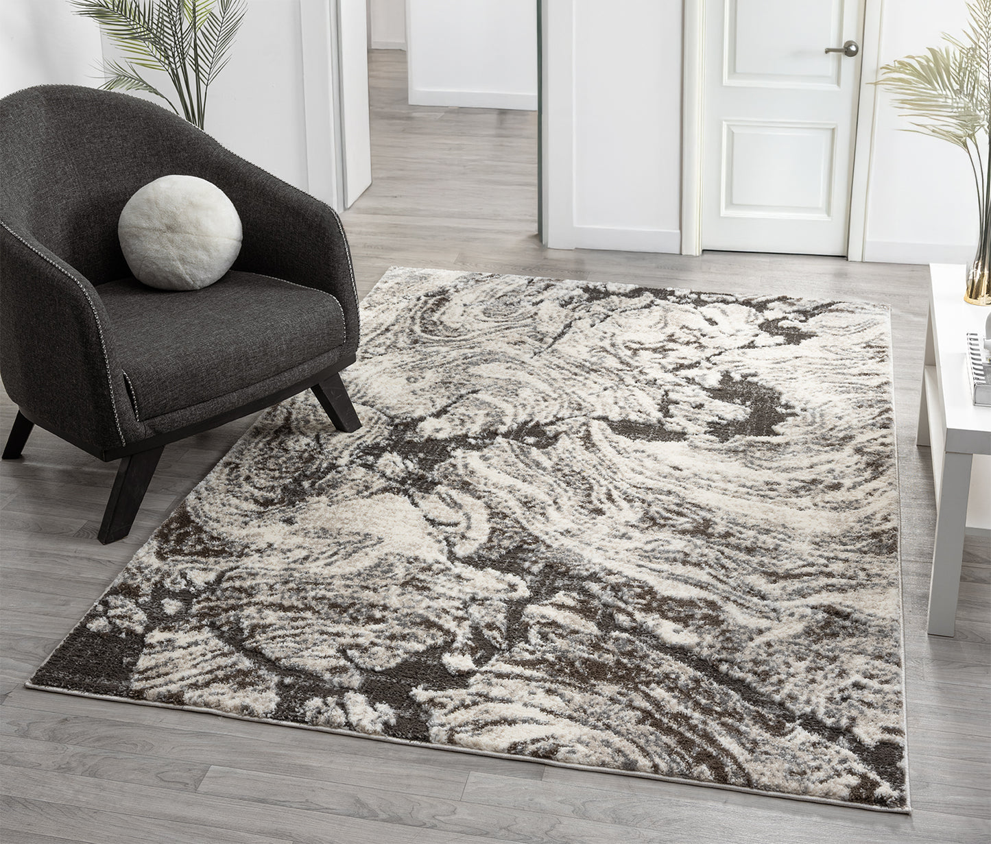 Grey Eleanor Astro embossed abstract rug, in a room setting