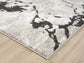 Mocha Eleanor Astro embossed abstract rug, corner fold detail