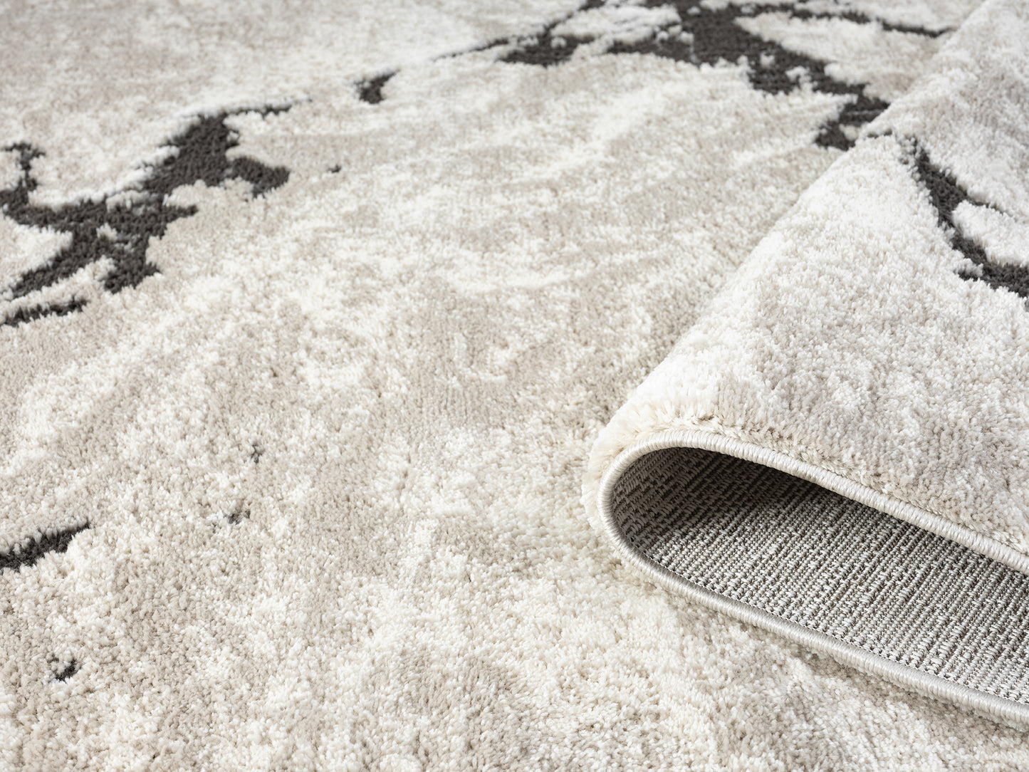 Mocha Eleanor Astro embossed abstract rug, rolled view