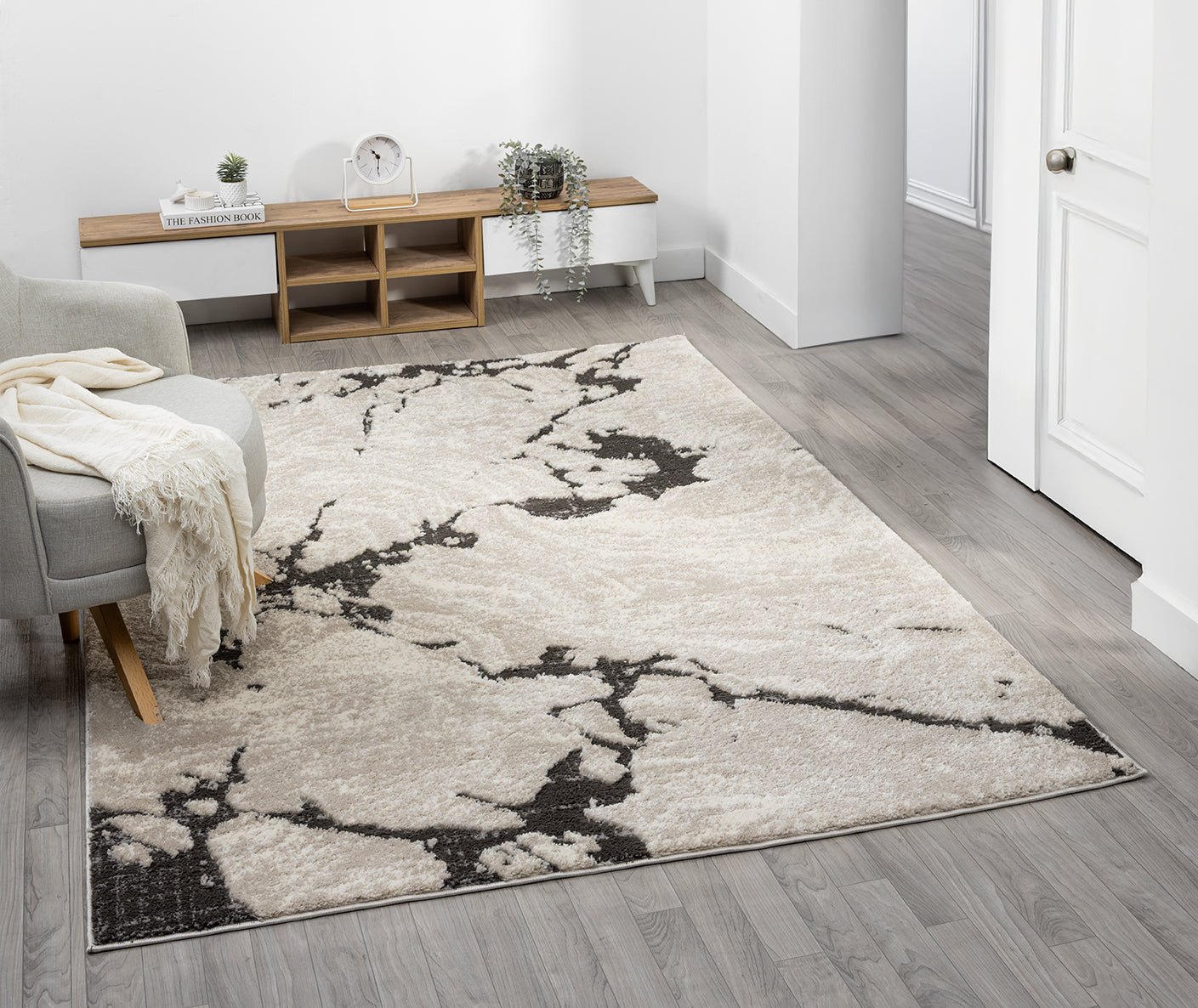 Mocha Eleanor Astro embossed abstract rug, in a room setting