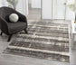 Grey Eleanor Linear embossed abstract rug, in a room setting