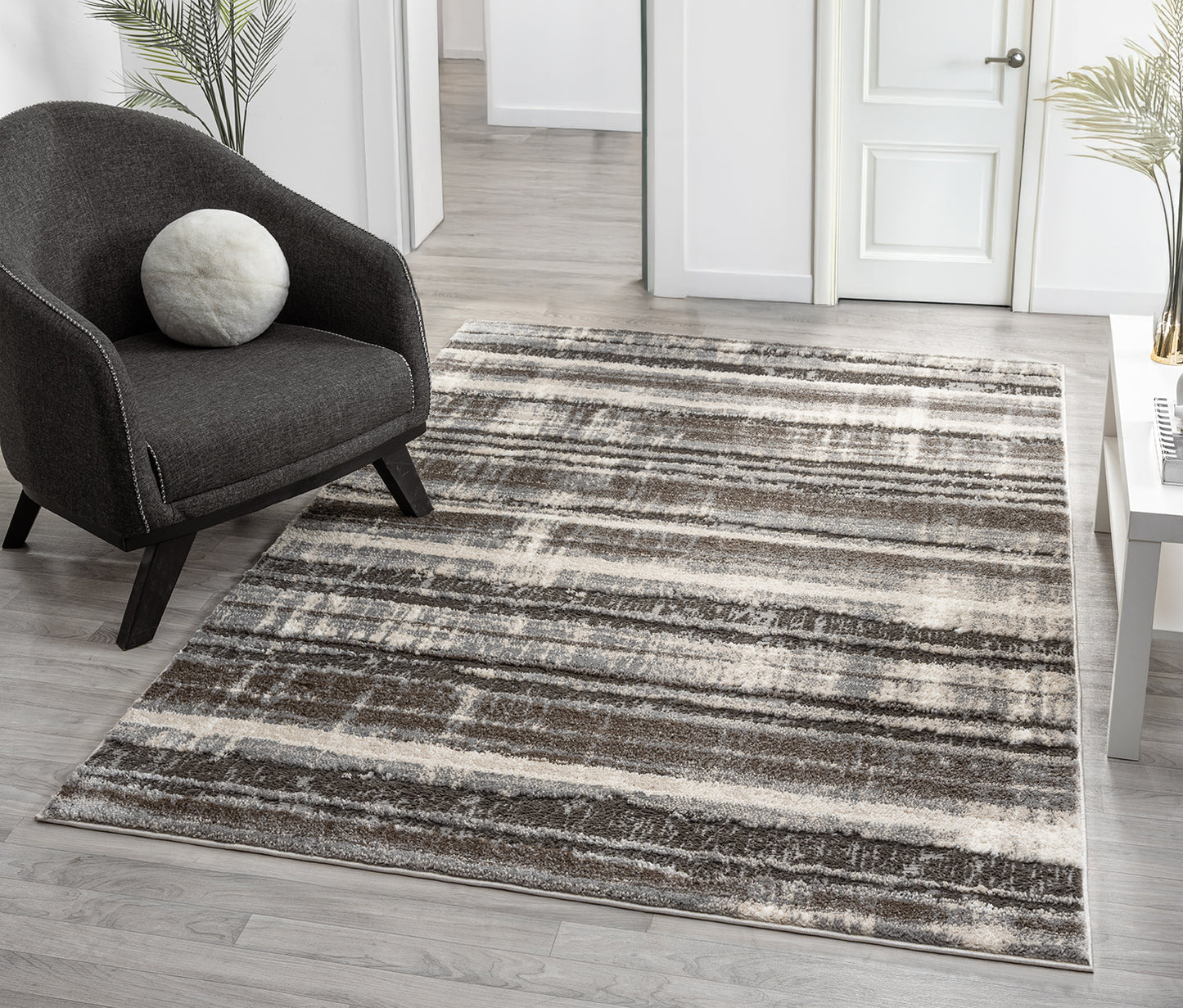 Grey Eleanor Linear embossed abstract rug, in a room setting