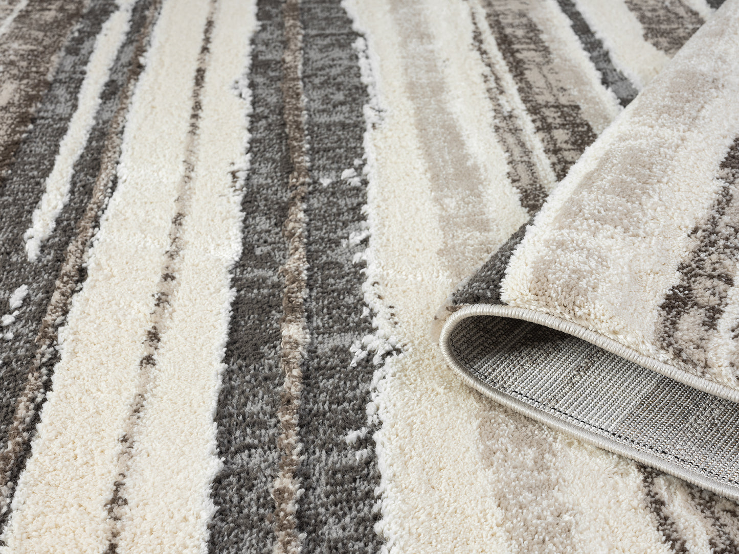 Mocha Eleanor Linear embossed abstract rug, rolled view