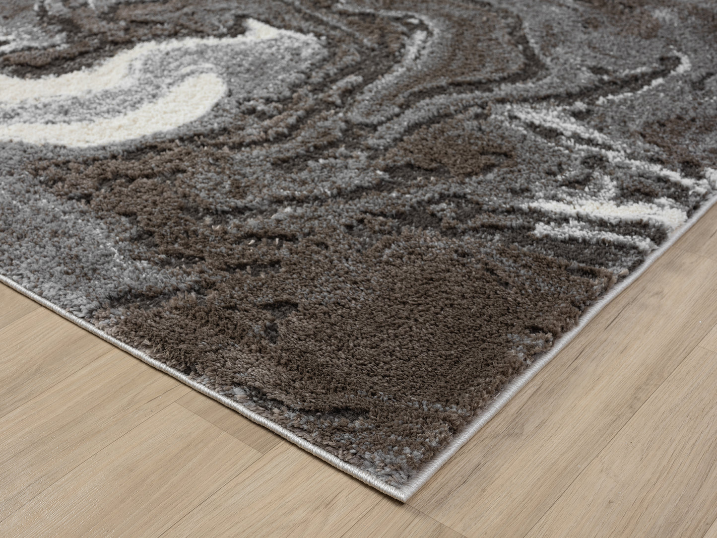 Grey Eleanor Marble embossed abstract rug, corner fold detail