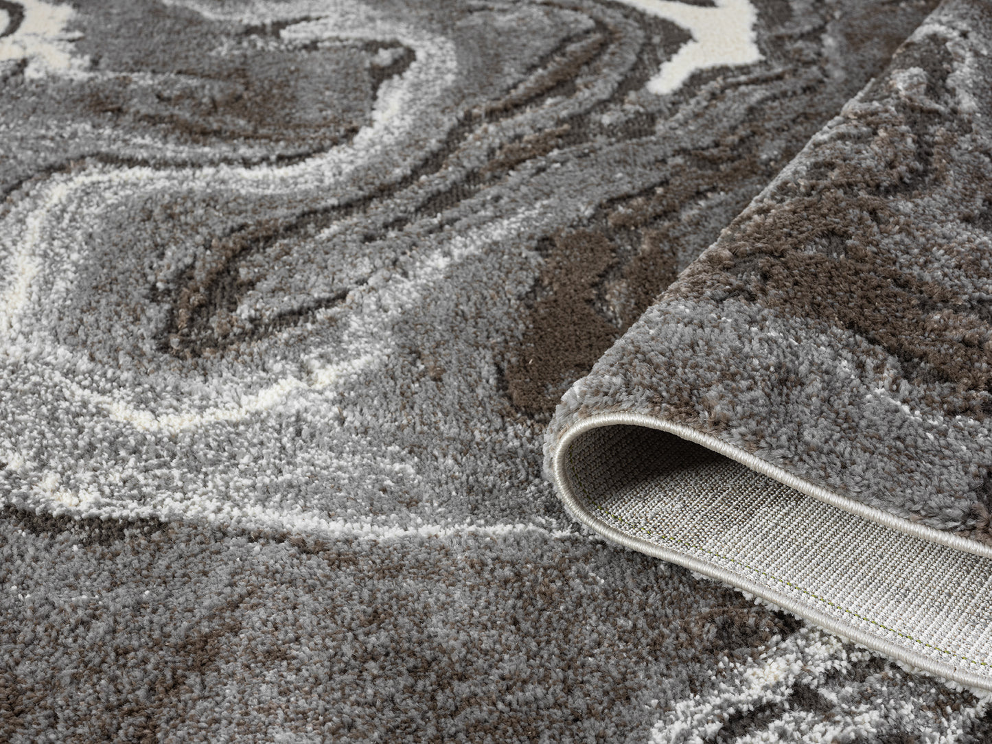 Grey Eleanor Marble embossed abstract rug, rolled view