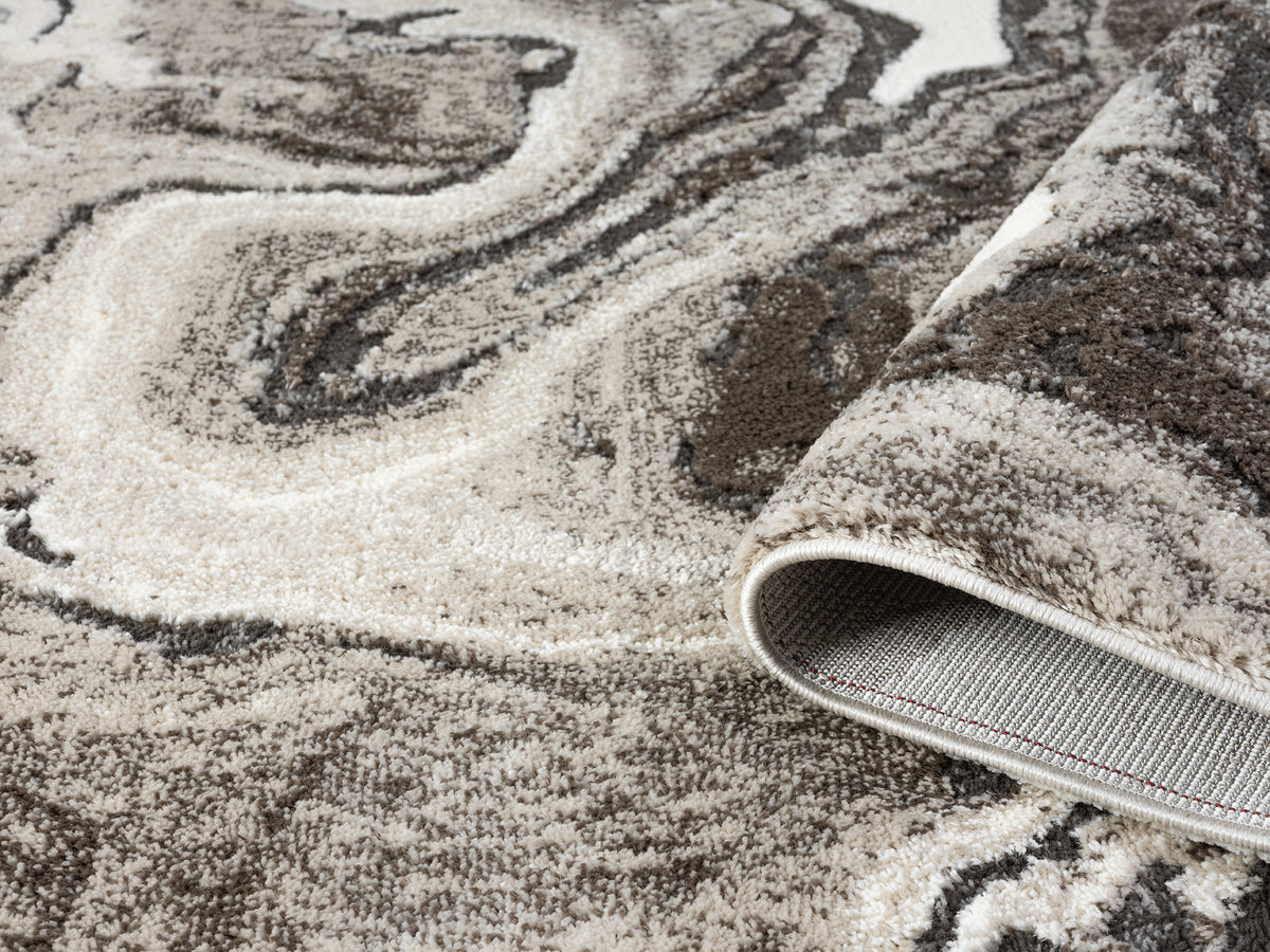 Mocha Eleanor Marble embossed abstract rug, rolled view