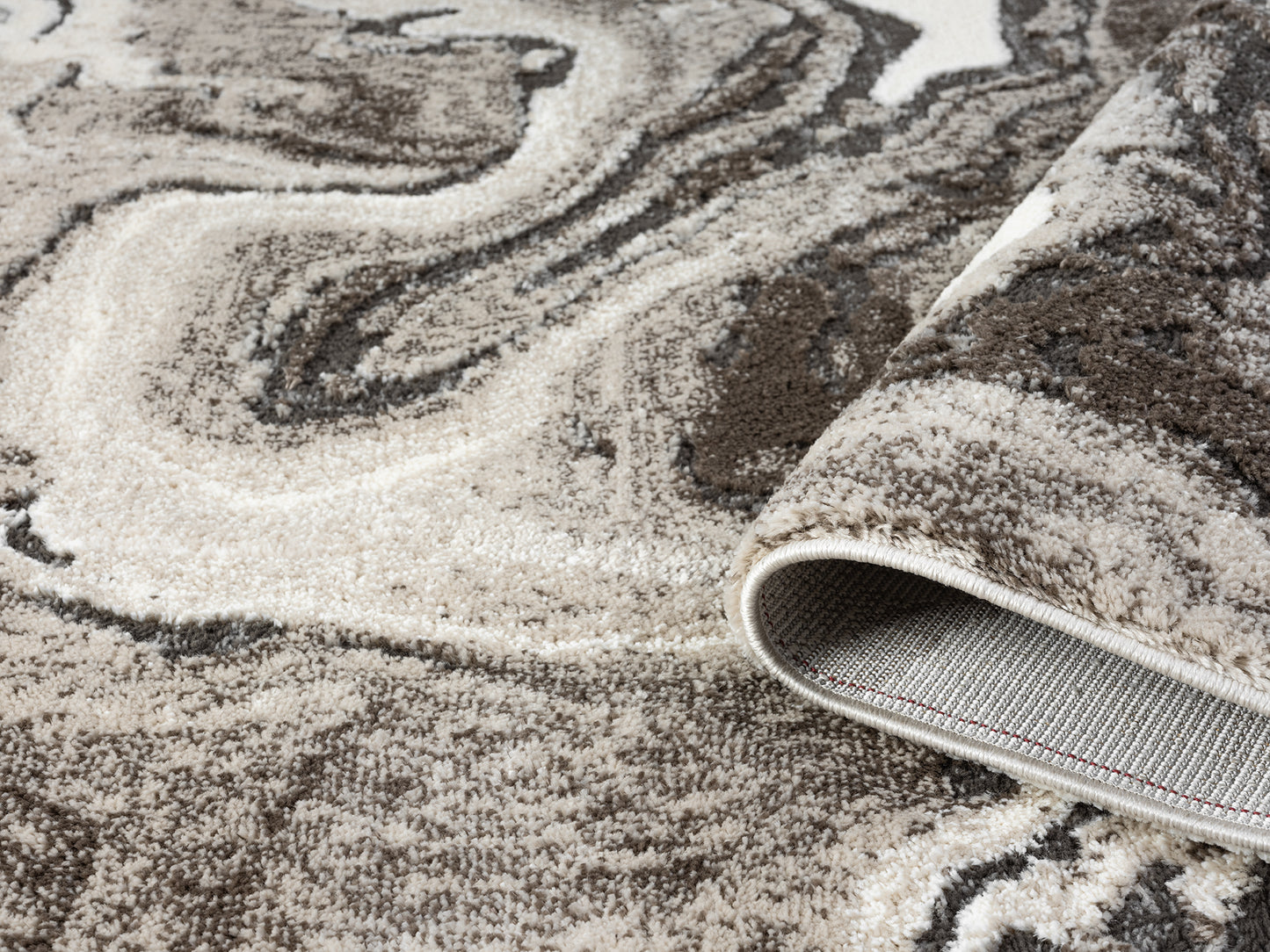Mocha Eleanor Marble embossed abstract rug, rolled view