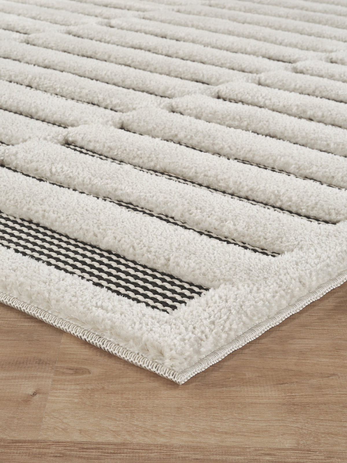 Cream Freya Bar embossed geometric rug, side profile