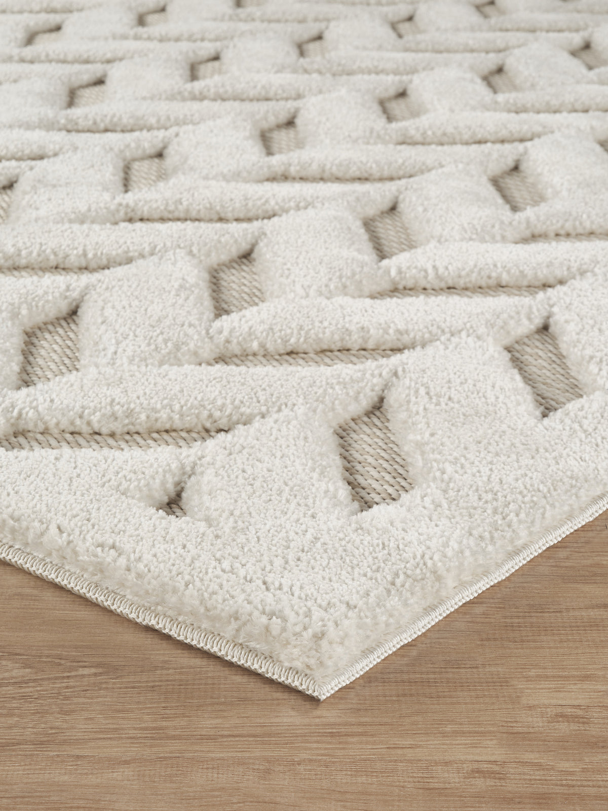 Cream Freya Herringbone embossed geometric rug, side profile