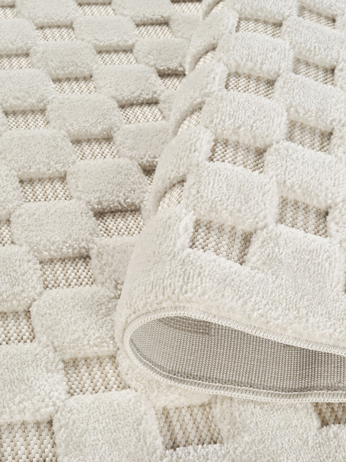 Cream Freya Square embossed geometric rug, close-up pile detail