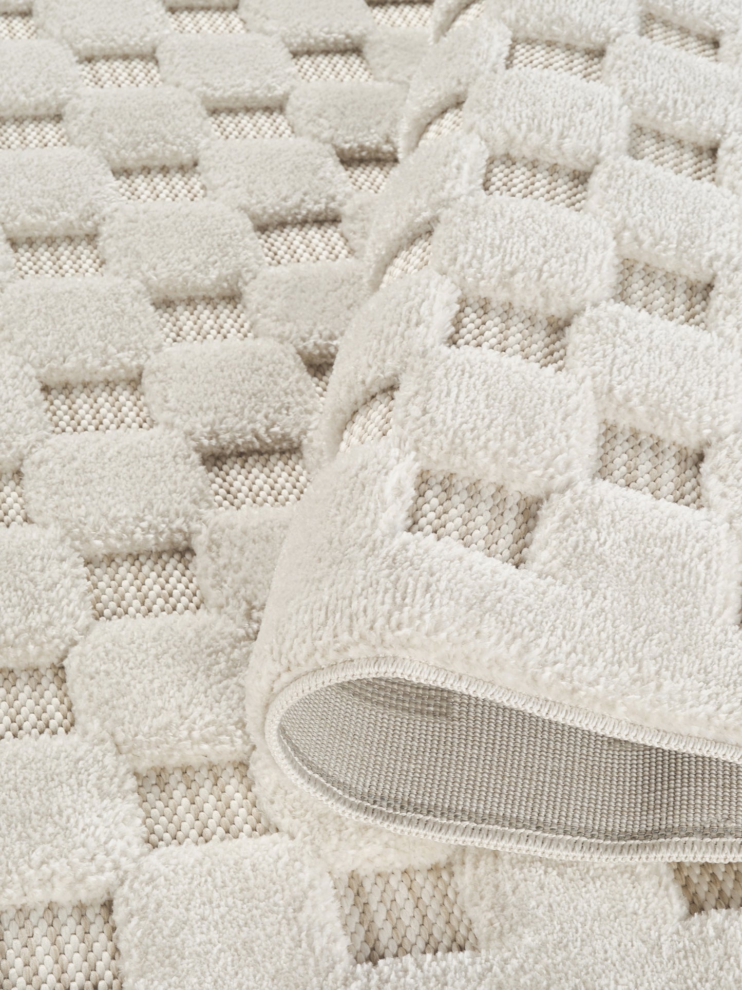 Cream Freya Square embossed geometric rug, close-up pile detail