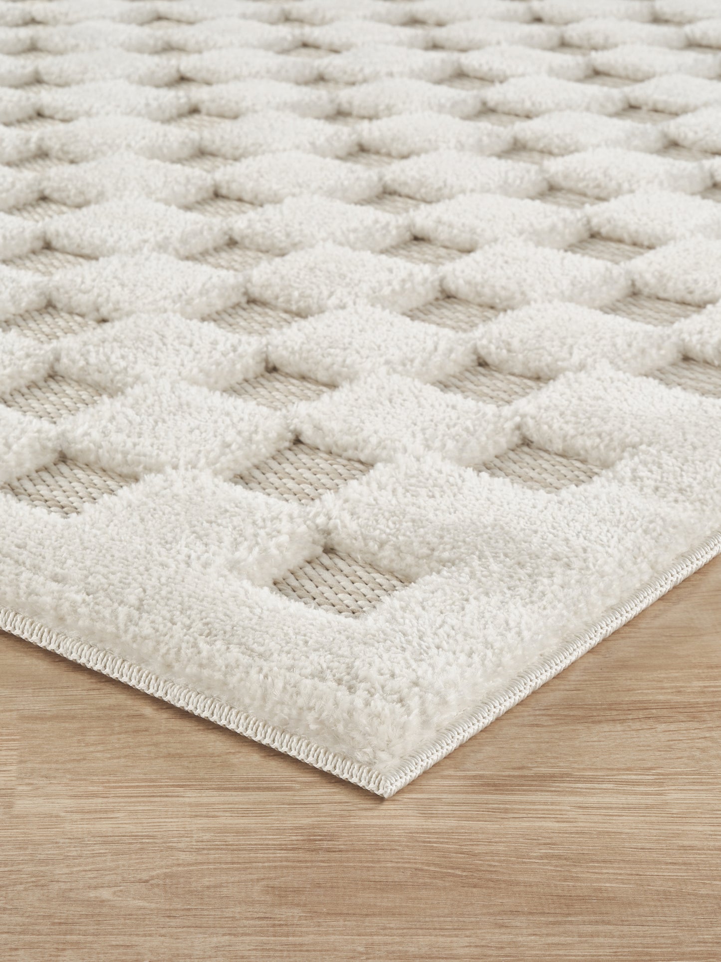 Cream Freya Square embossed geometric rug, side profile
