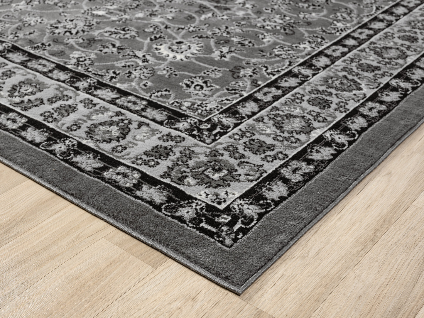 Grey Obsidian Classic monochrome rug, corner fold detail