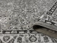 Grey Obsidian Classic monochrome rug, rolled view