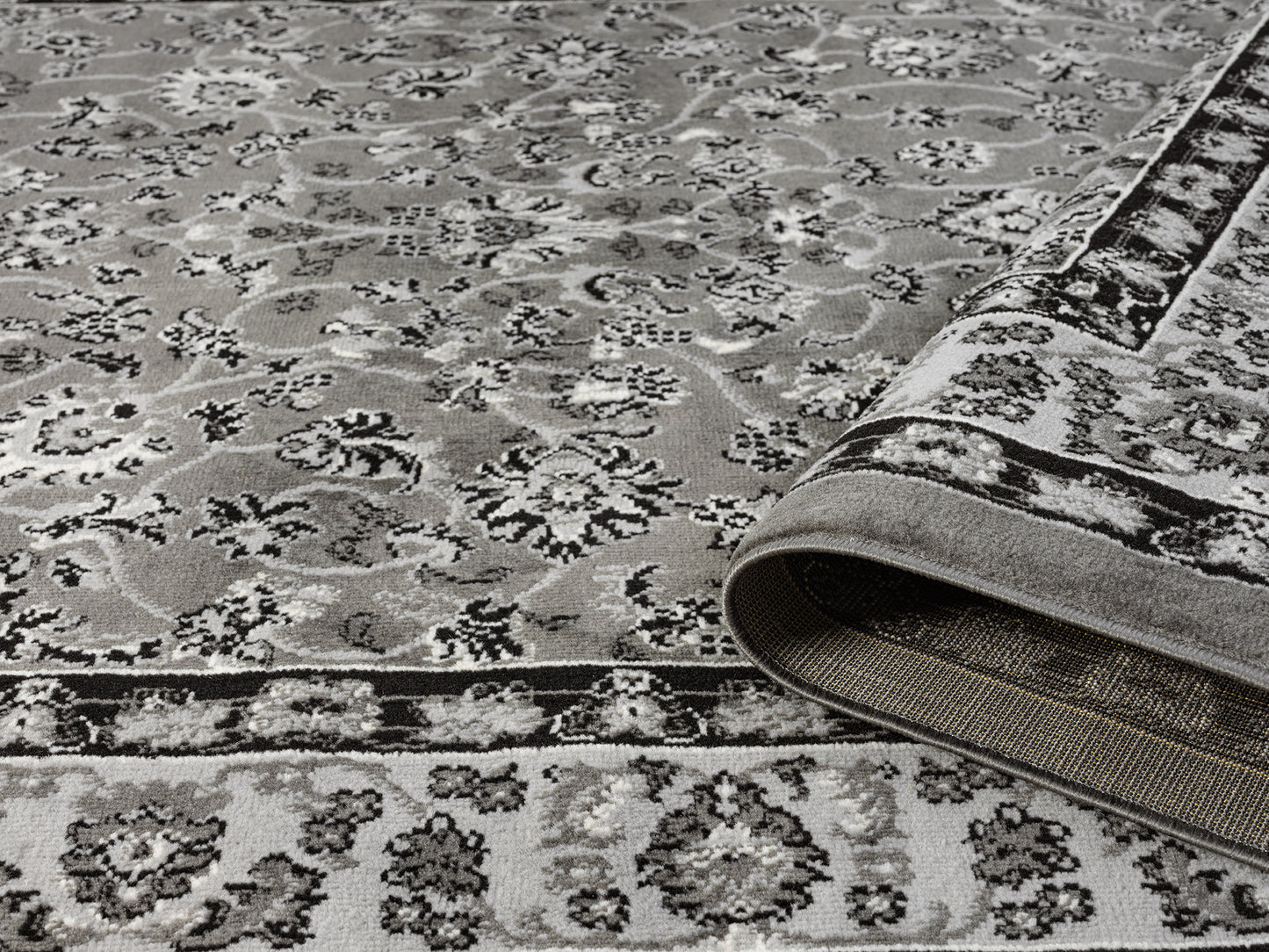 Grey Obsidian Classic monochrome rug, rolled view