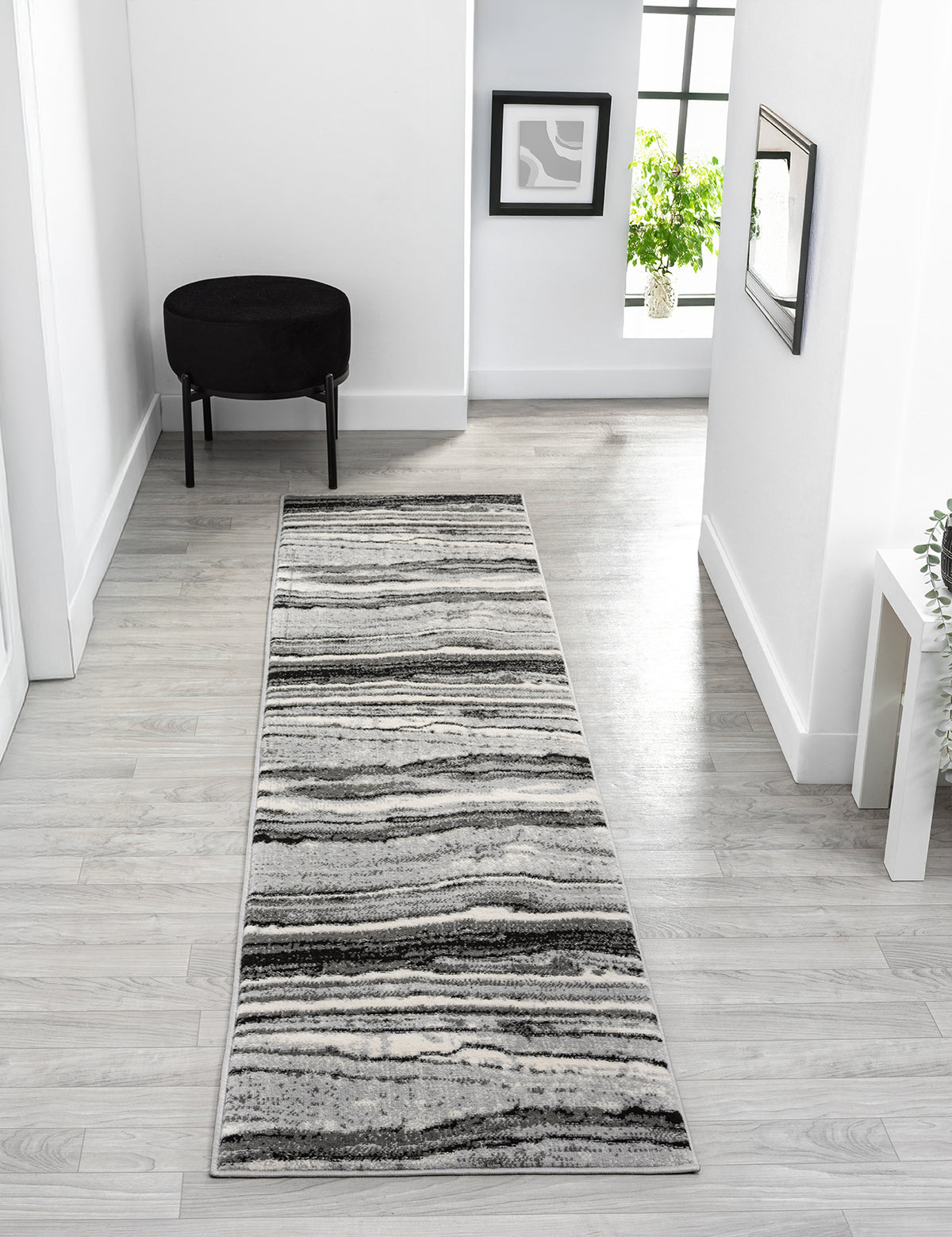 Grey Obsidian Coast monochrome rug, in a room setting 3