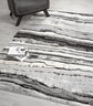 Grey Obsidian Coast monochrome rug, in a room setting 2