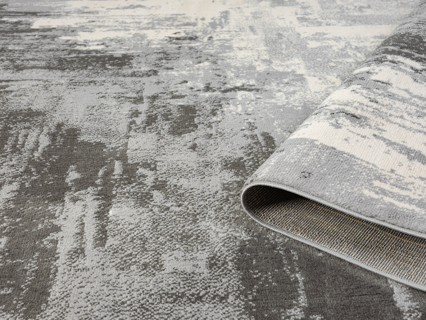 Grey Obsidian Craft monochrome rug, rolled view