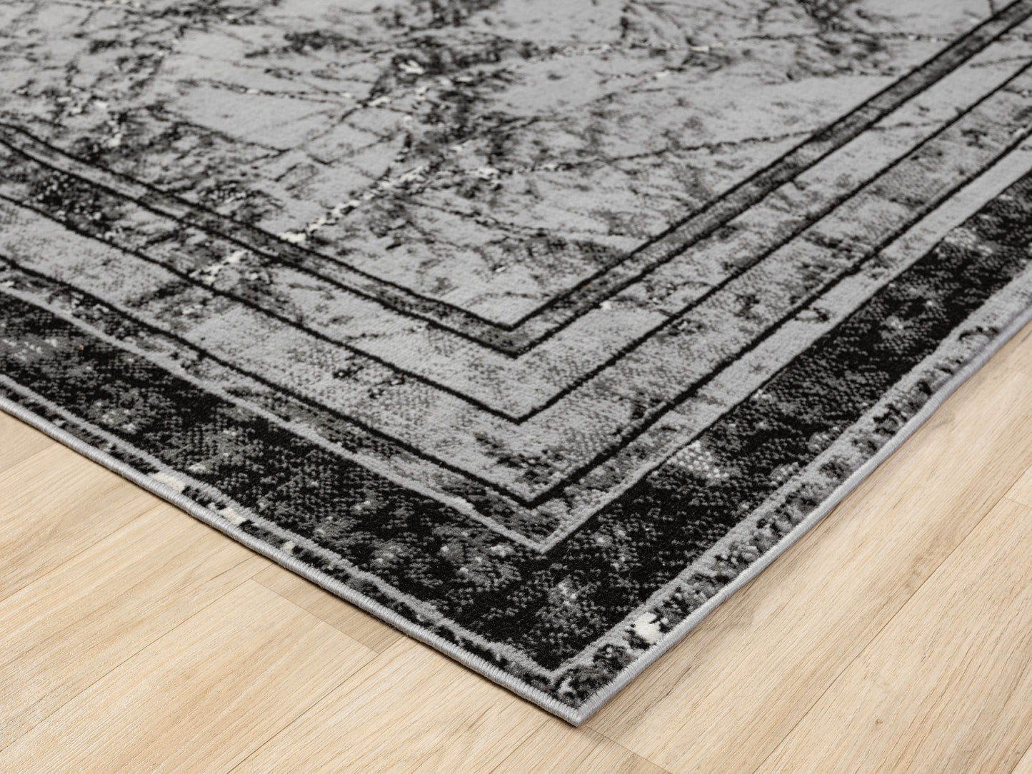 Grey Obsidian Frame monochrome rug, corner fold detail