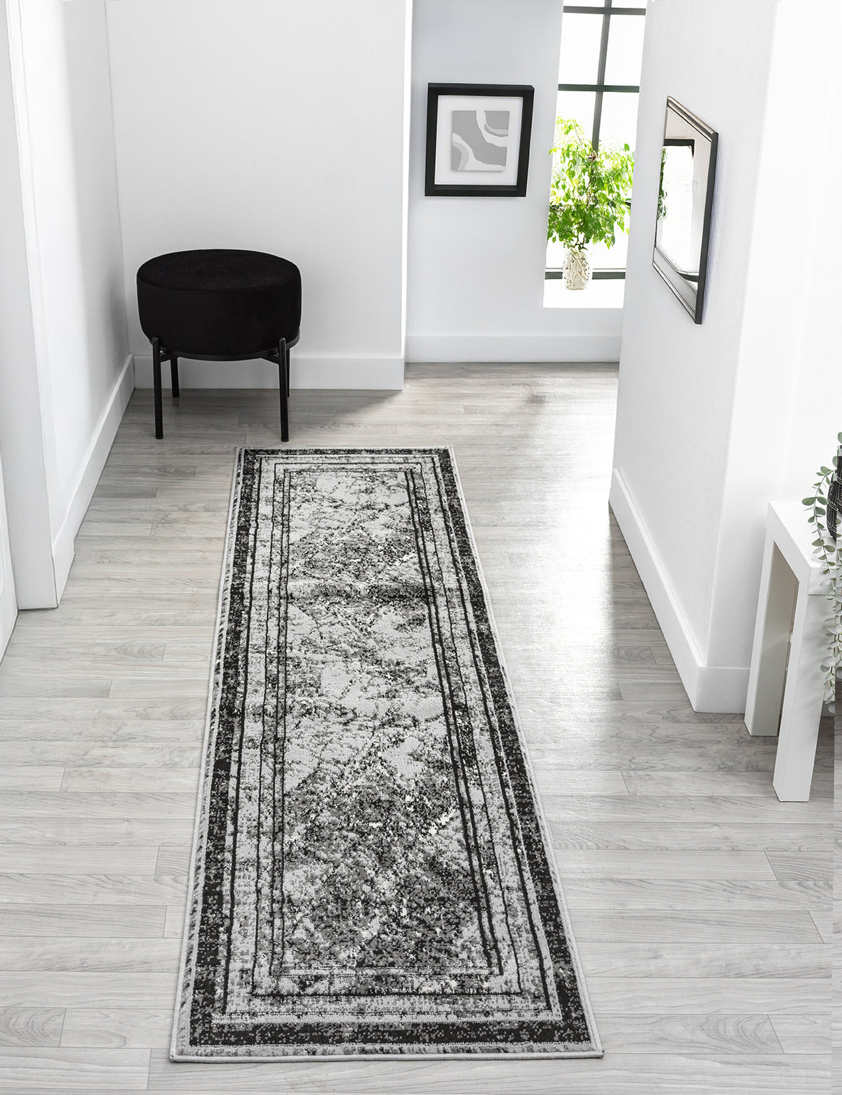 Grey Obsidian Frame monochrome rug, in a room setting 3