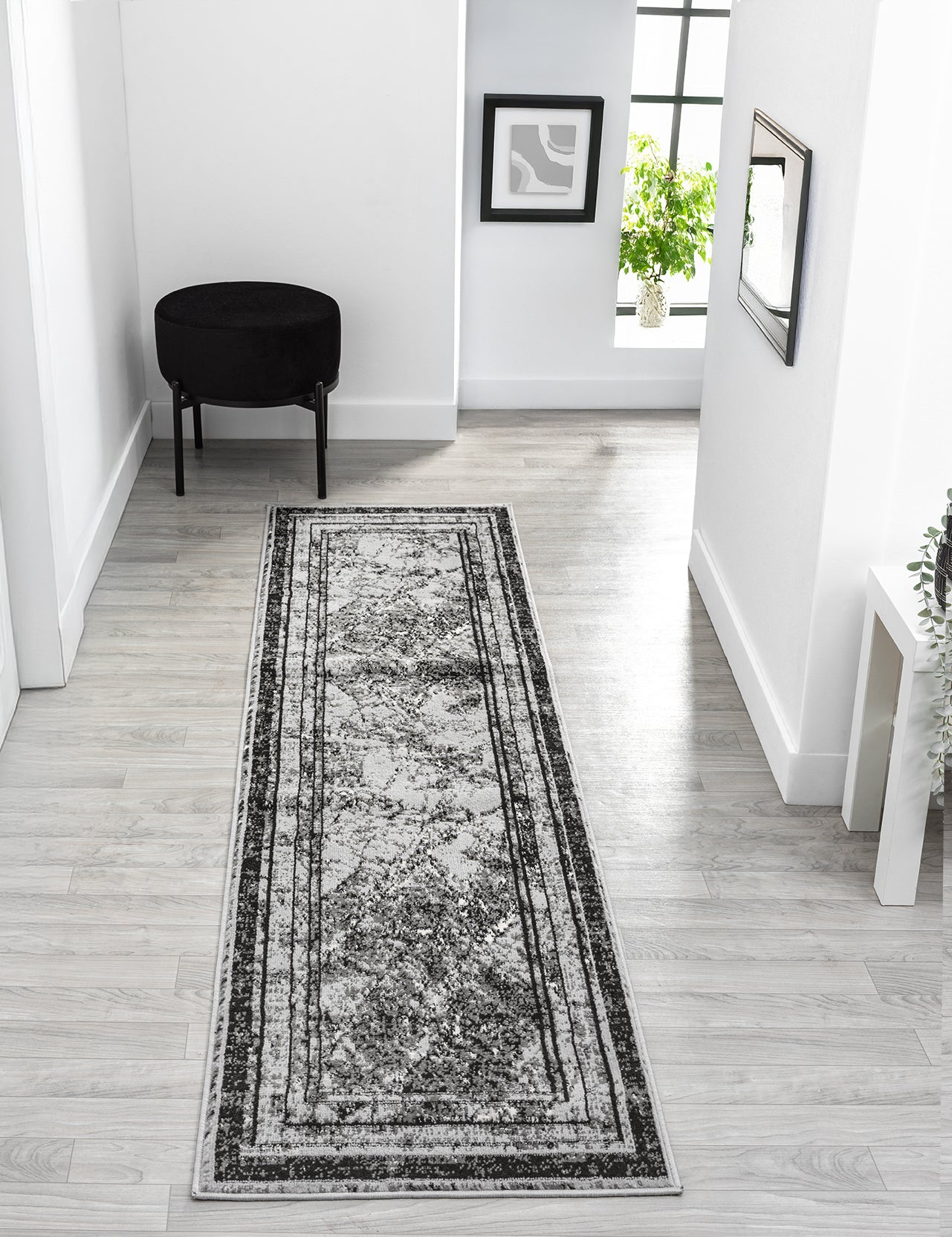 Grey Obsidian Frame monochrome rug, in a room setting 3