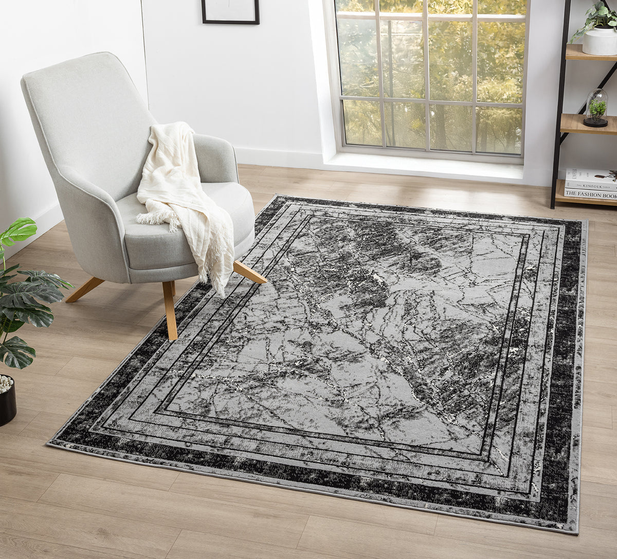 Grey Obsidian Frame monochrome rug, in a room setting