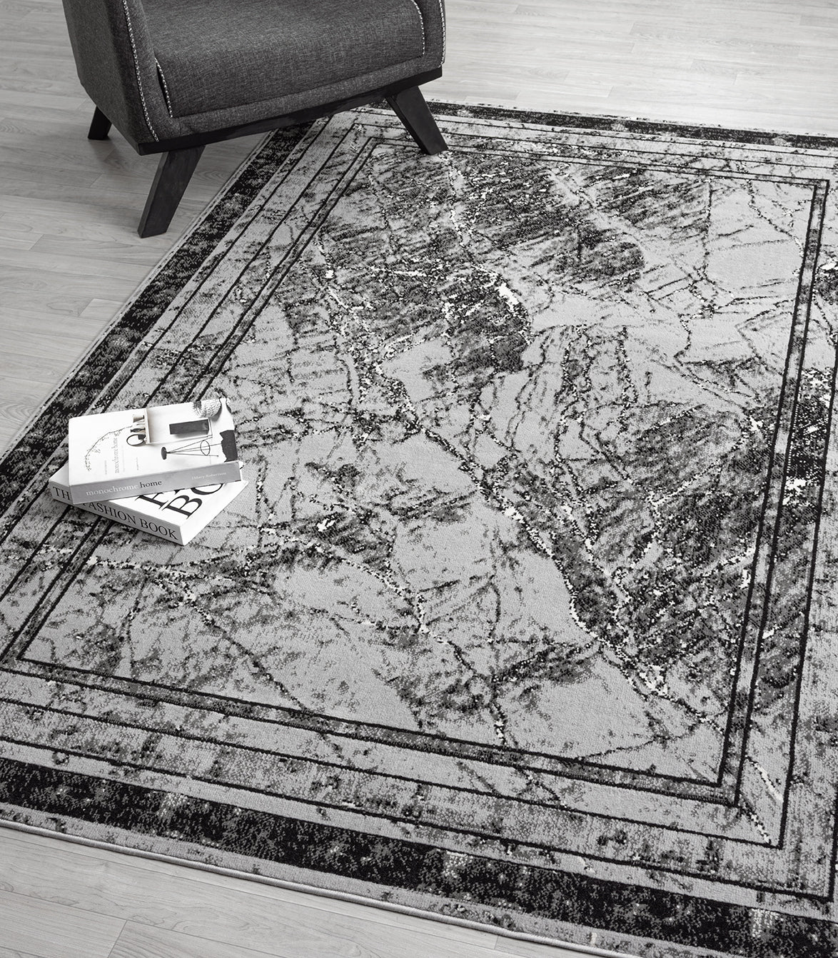 Grey Obsidian Frame monochrome rug, in a room setting 2