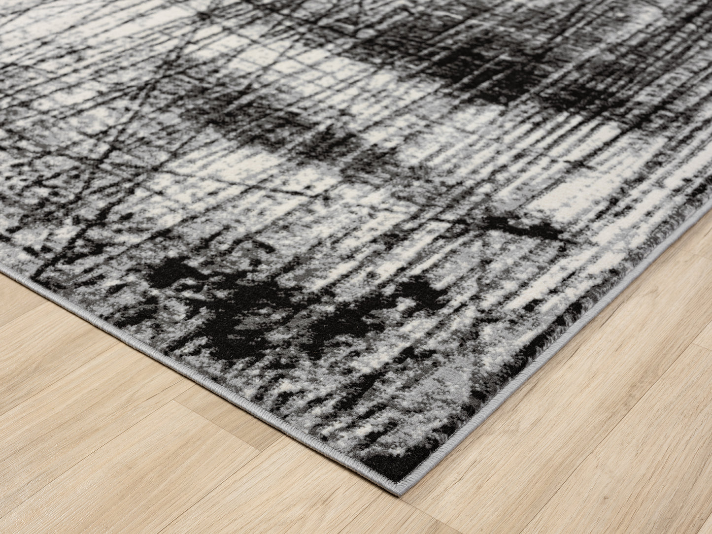 Grey Obsidian Oblique monochrome rug, corner fold detail