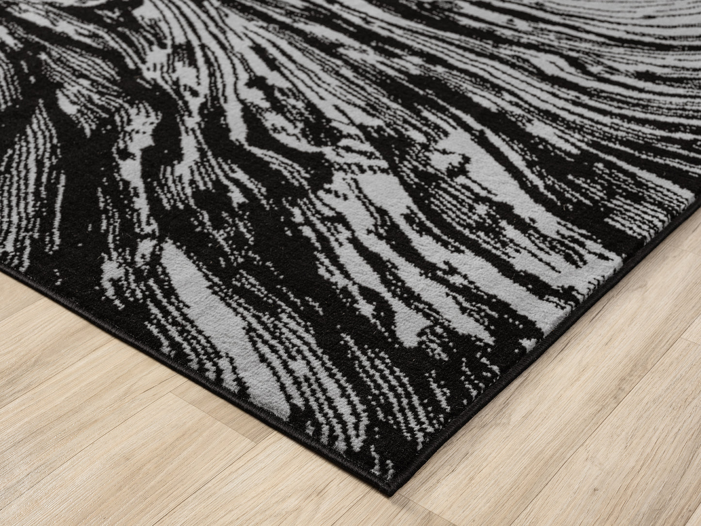 Grey Obsidian Whirlpool monochrome rug, corner fold detail