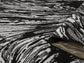 Grey Obsidian Whirlpool monochrome rug, rolled view