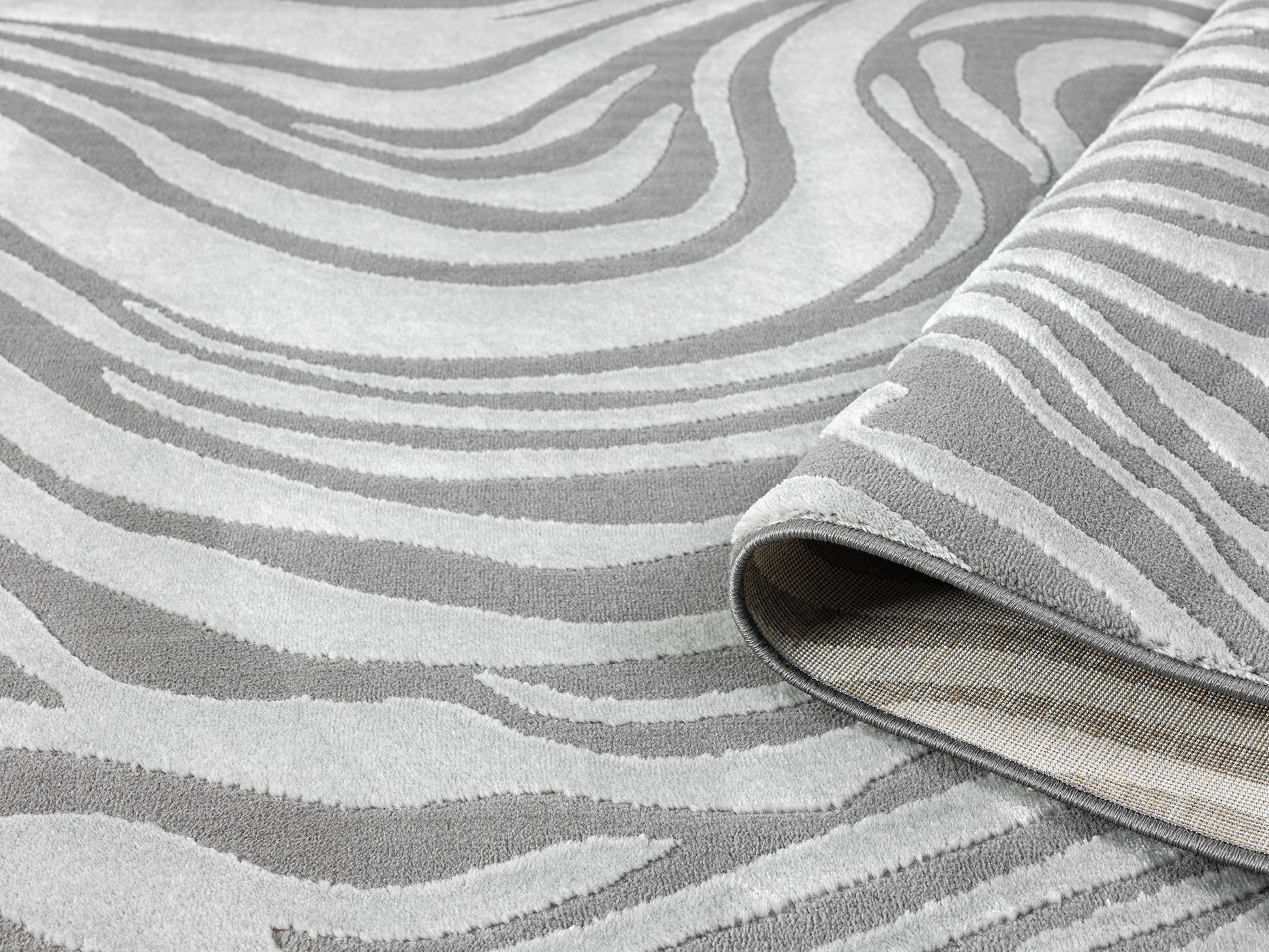 Anthracite Vellure Marble textured geometric rug, rolled view