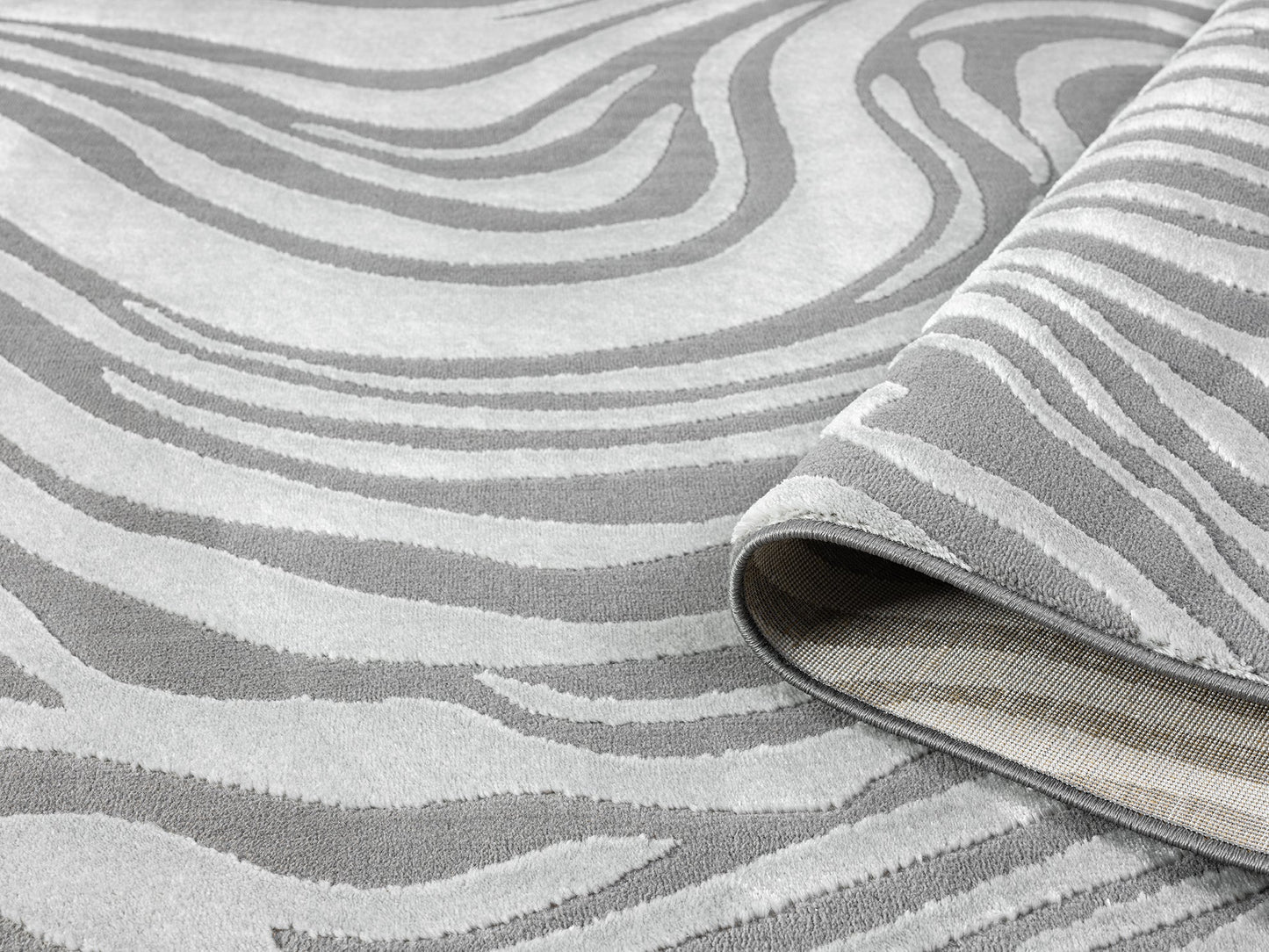 Anthracite Vellure Marble textured geometric rug, rolled view
