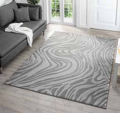 Anthracite Vellure Marble textured geometric rug, in a room setting